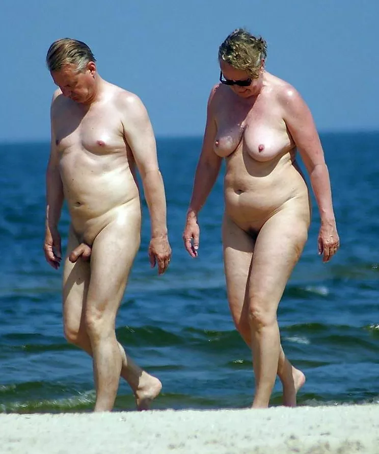 Nude elderly naturist at the beach. This elderly hoe a real freak, in public